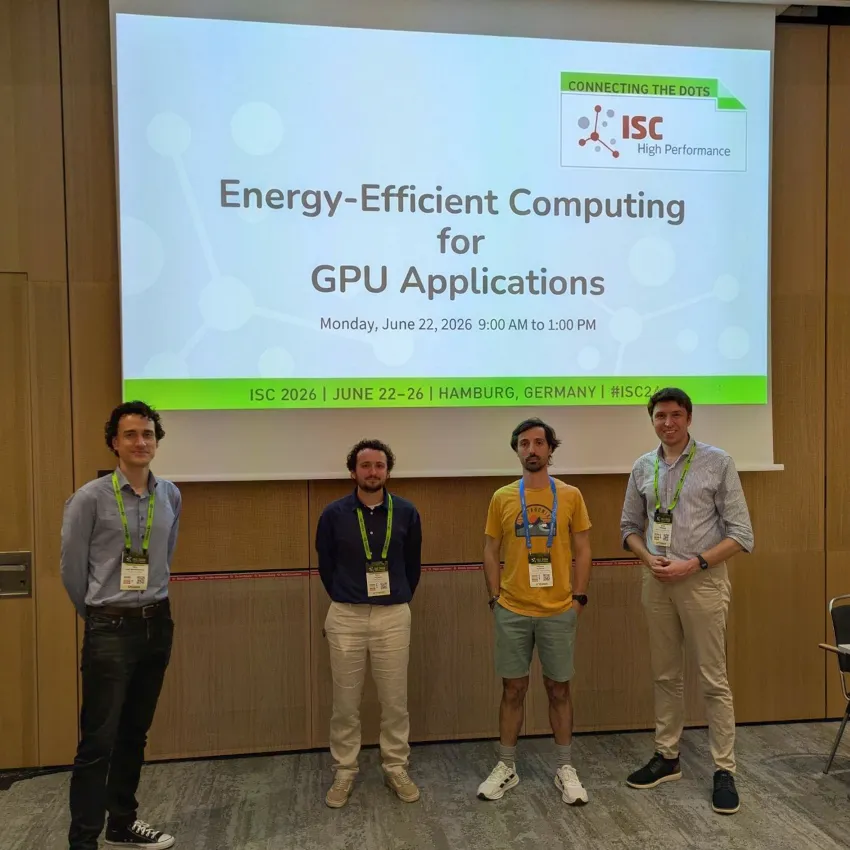 Four presenters standing beneath the Energy-Efficient Computing for GPU Applications tutorial screen